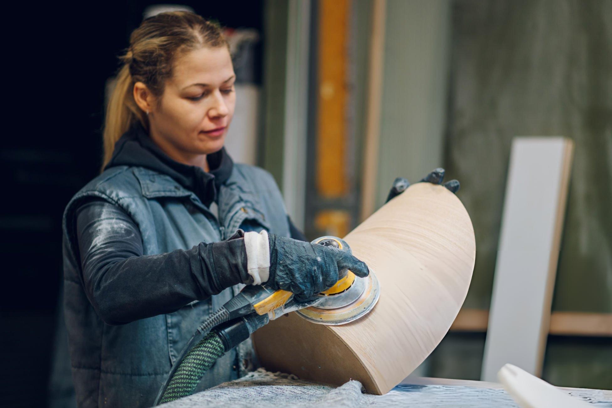 Orbital sander swirl marks on wood revealed by raking light before staining or finishing